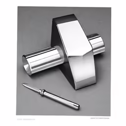 a chrome plated toilet paper holder with an extra long, modern shaped lid