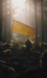 there is a flag in the woods that is yellow