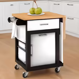 a white and black kitchen cart with apples on top of it