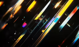 multiple bright streaks of colorful light