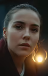 a young woman with the light on