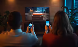 people in a room with phones taking pictures