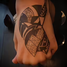 a tattoo that is done on the bottom of a hand