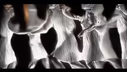 a black and white image of three women in dresses