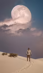 a man is walking across a desert by a moon