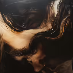 a woman is bending her hair forward