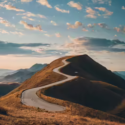 an open road winding between two hills