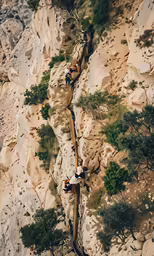 two people on the path to the top of the mountain