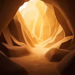 the light shines in a cave entrance