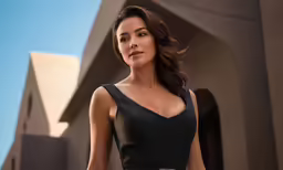 a woman is dressed in black for a picture