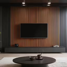 a contemporary living room is furnished with a sleek black coffee table and flat panel wall unit