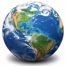 an earth globe with a light reflecting off the surface