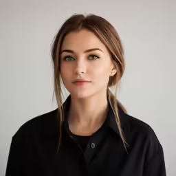 a woman in a black shirt with long hair