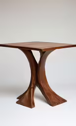 a wood table with wooden pedestals and wood tops