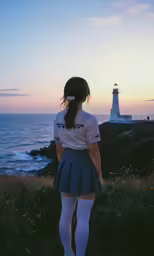 a girl in uniform looking out at the ocean