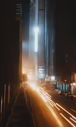 a car moving down a street at night