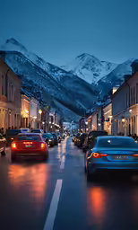 cars on a street lined with buildings in the night