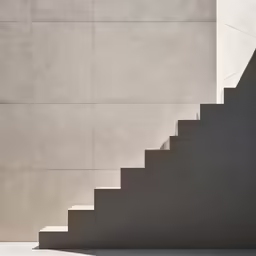 a person standing at the top of a step near an umbrella