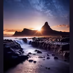 a water fall with a sun setting behind it
