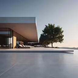 an empty patio near a lake with trees