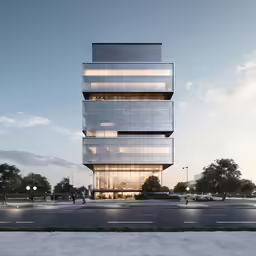 a tall glass tower sitting on the side of a road