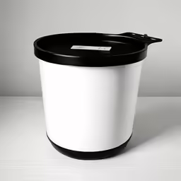 the black and white trash can is empty