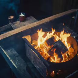 fire and smoke in a cooking stove with food