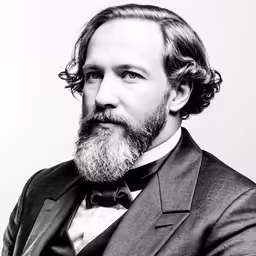an old fashioned photograph of a man with a beard and wearing a suit