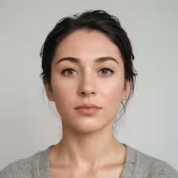 the beautiful young lady is wearing a gray shirt