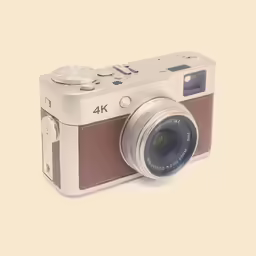 the camera has a lens and is brown
