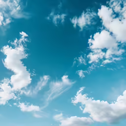 a couple of people on surfboards with clouds behind them