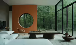 a bedroom with large windows, and a bed inside