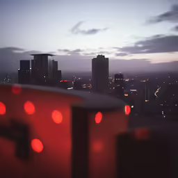 some buildings at night light up red lights