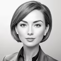 a woman with a short haircut wearing a jacket