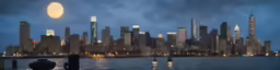 night time view of city skylines over water