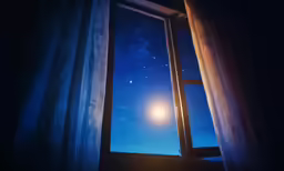 the view outside the window at night, with no light