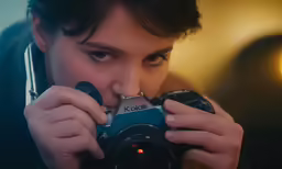 a person holding up a camera to take a picture