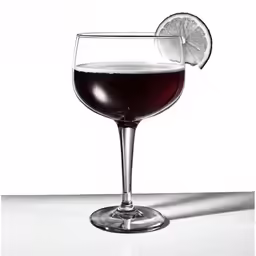 a white table top with an alcoholic drink