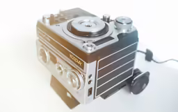 an old style radio with its wheels missing