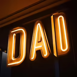 a neon sign is set up in front of a building
