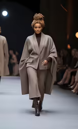 a model wearing a hat on the runway