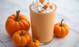 pumpkins with whipped cream in the middle of them