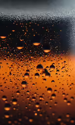 rain drops on the glass outside with black background