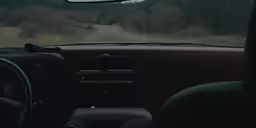the view of a street from inside a car
