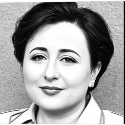 a woman poses with her eyes half closed