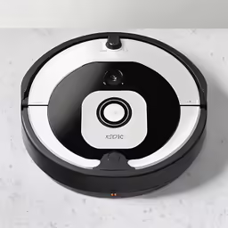 a robotic vacuum that has its lid open
