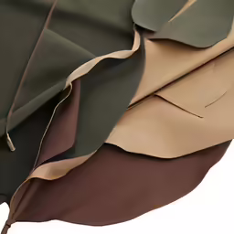 a piece of brown and green cloth on top of each other