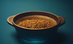 a wooden bowl filled with lots of grain