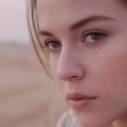 an attractive woman is staring into the camera
