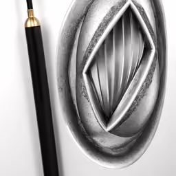 a pen and a fancy design on a surface